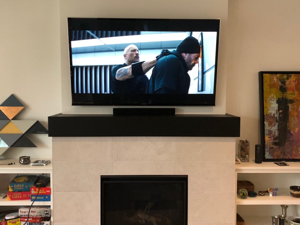 Mopounted a 65" TV over the fireplace and seamlessly integrated their Sonos soundbar in without any wires showing.